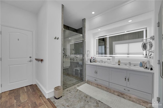 bathroom featuring vanity, hardwood / wood-style flooring, and an enclosed shower