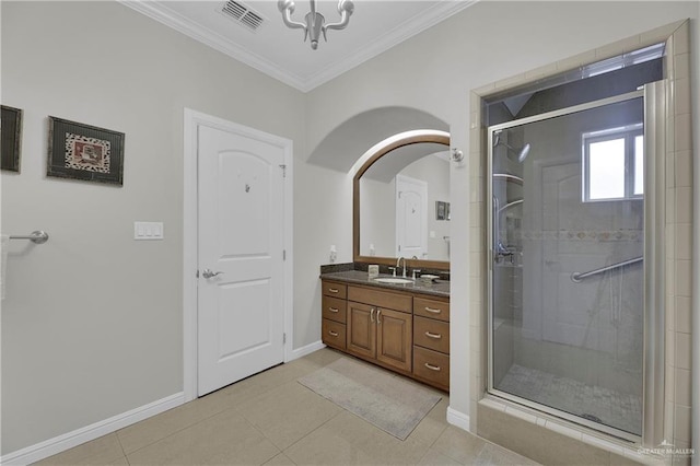 bathroom featuring tile patterned floors, crown molding, vanity, and an enclosed shower