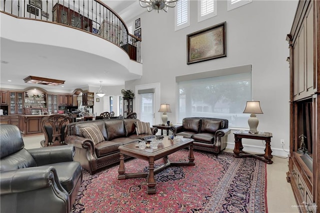 living room with light tile patterned floors and a high ceiling