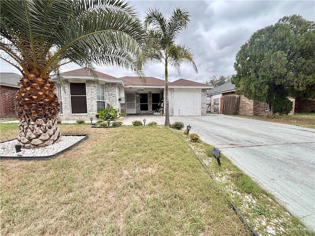 ranch-style home with a front yard and a garage