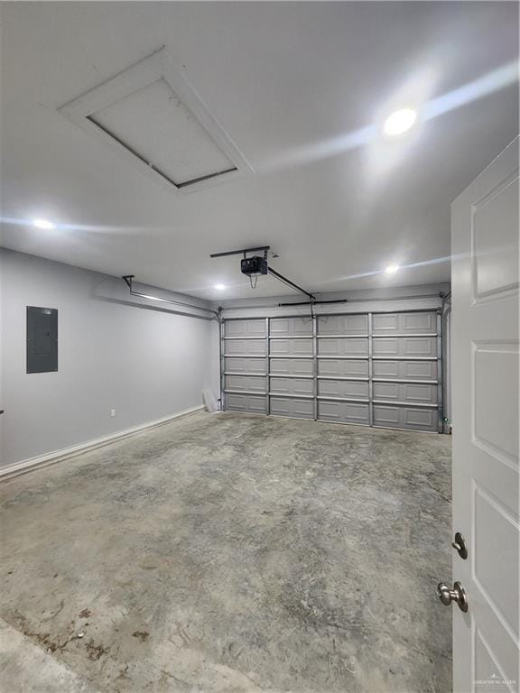 garage with electric panel and a garage door opener