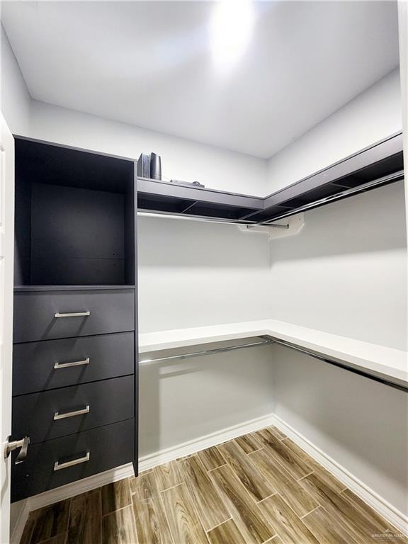 walk in closet featuring wood-type flooring