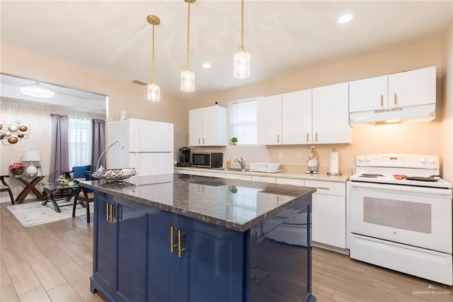 8814 S Mould Dr, Pharr, TX 78577 - kitchen featuring white appliances, under cabinet range hood, blue cabinetry, white cabinetry, and a kitchen island