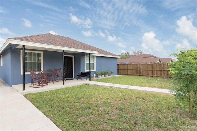 8814 S Mould Dr, Pharr, TX 78577 - back of house with stucco siding, a patio area, and a shingled roof