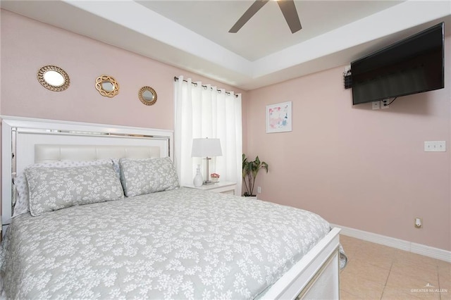 8814 S Mould Dr, Pharr, TX 78577 - tiled bedroom featuring baseboards, ceiling fan, and a tray ceiling