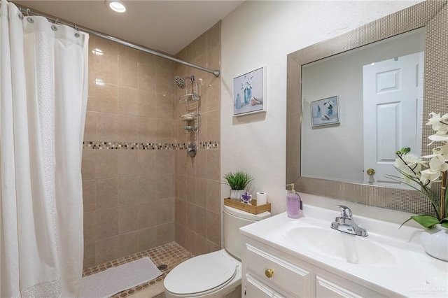 8814 S Mould Dr, Pharr, TX 78577 - full bathroom with tiled shower, vanity, toilet, and recessed lighting