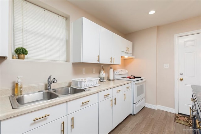 8814 S Mould Dr, Pharr, TX 78577 - kitchen featuring white electric stove, under cabinet range hood, a sink, white cabinetry, and light wood finished floors