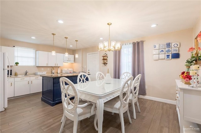 8814 S Mould Dr, Pharr, TX 78577 - dining room featuring a chandelier, light wood-style flooring, baseboards, and recessed lighting