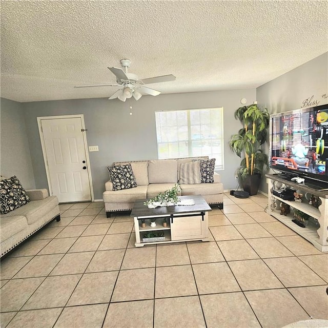 1414 Vatia Blvd, Mission, TX 78572 - living room featuring a ceiling fan, light tile patterned flooring, and a textured ceiling
