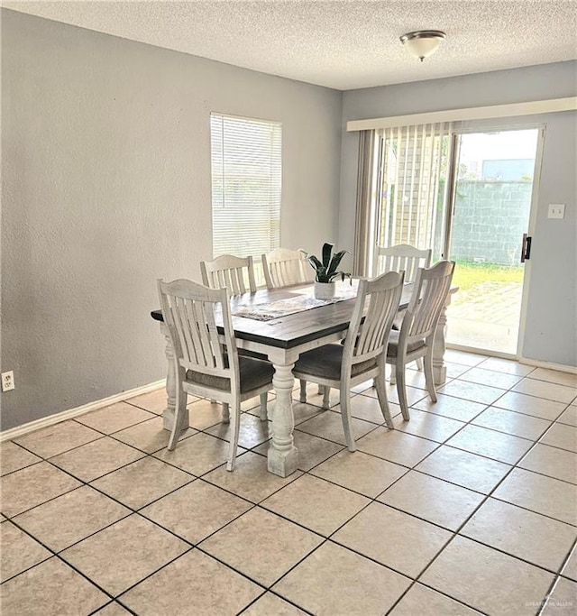 1414 Vatia Blvd, Mission, TX 78572 - dining room featuring a textured wall, a textured ceiling, and light tile patterned floors