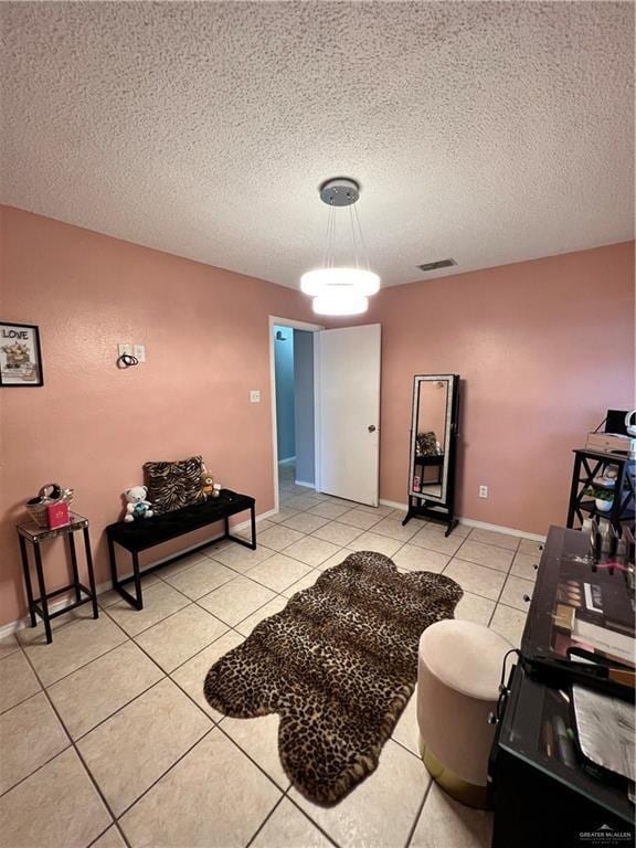 1414 Vatia Blvd, Mission, TX 78572 - living area with a textured ceiling and light tile patterned floors