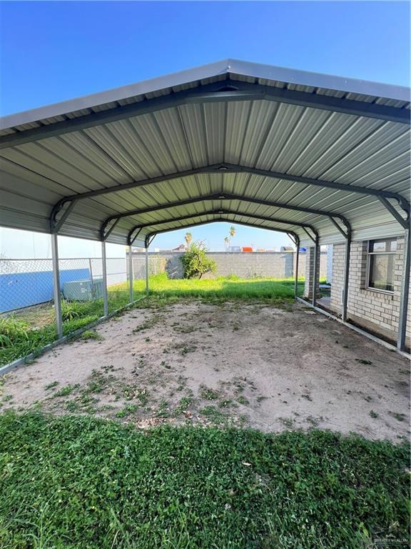 1414 Vatia Blvd, Mission, TX 78572 - view of parking / parking lot featuring a carport