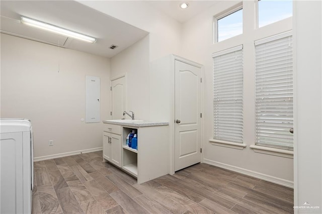 washroom featuring sink and washer / clothes dryer