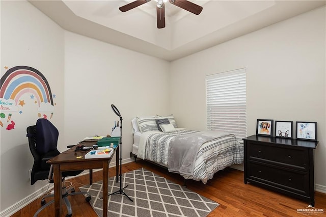 bedroom featuring ceiling fan and dark hardwood / wood-style flooring