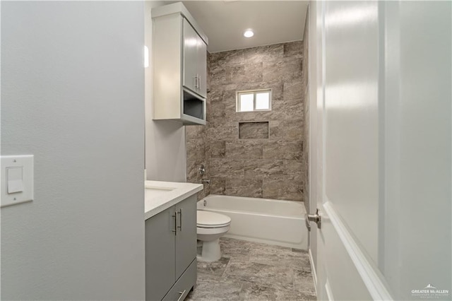 full bathroom with vanity, toilet, and tiled shower / bath