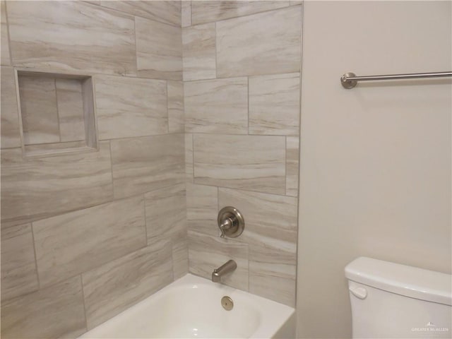 bathroom with toilet and  shower combination