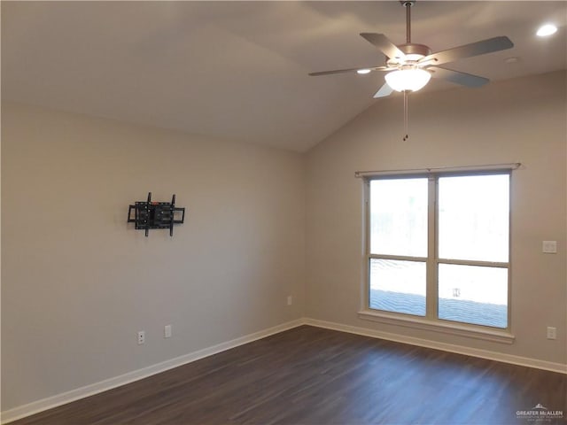 unfurnished room featuring baseboards, ceiling fan, dark wood-style flooring, and vaulted ceiling