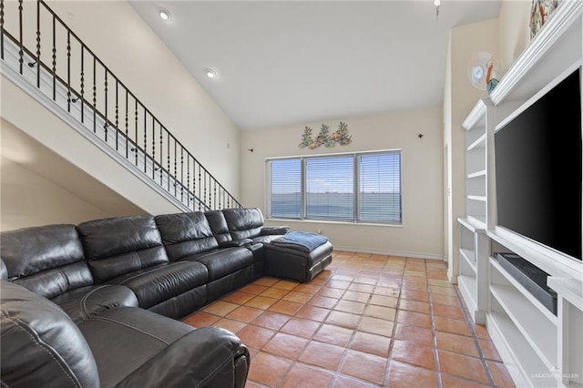 301 Houston Ave, Port Isabel, TX 78578 - living room featuring stairway, recessed lighting, high vaulted ceiling, and light tile patterned flooring