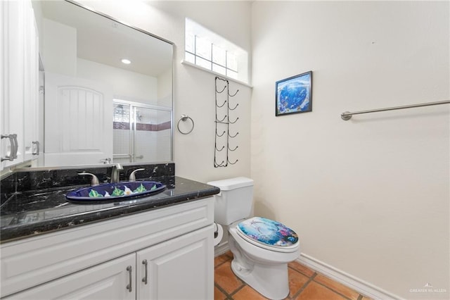 301 Houston Ave, Port Isabel, TX 78578 - full bathroom with vanity, tile patterned floors, and a stall shower