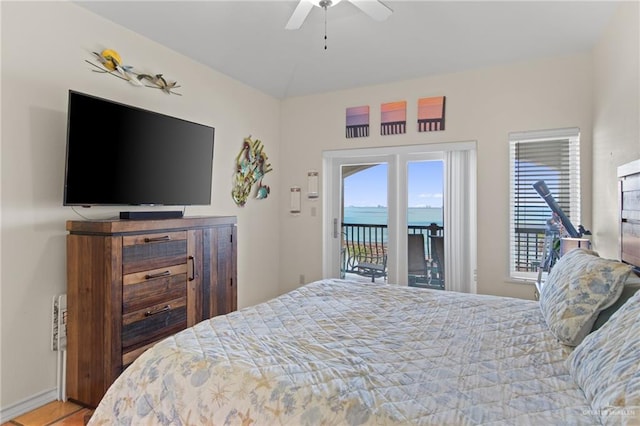 301 Houston Ave, Port Isabel, TX 78578 - bedroom with access to exterior, multiple windows, and ceiling fan