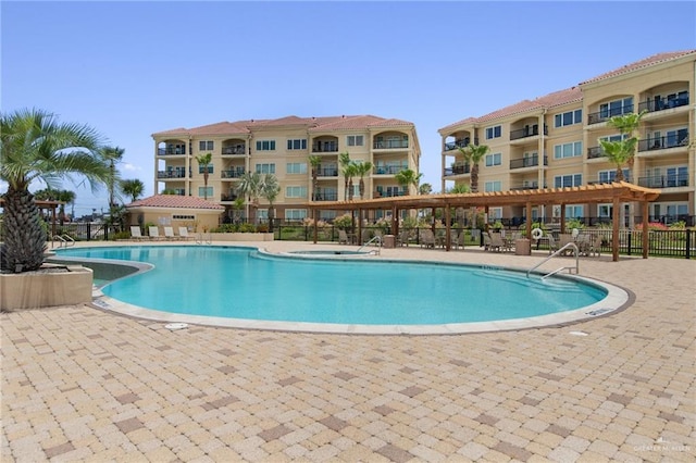 301 Houston Ave, Port Isabel, TX 78578 - community pool featuring a patio area