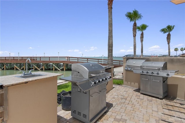 301 Houston Ave, Port Isabel, TX 78578 - view of patio featuring a grill and a water view