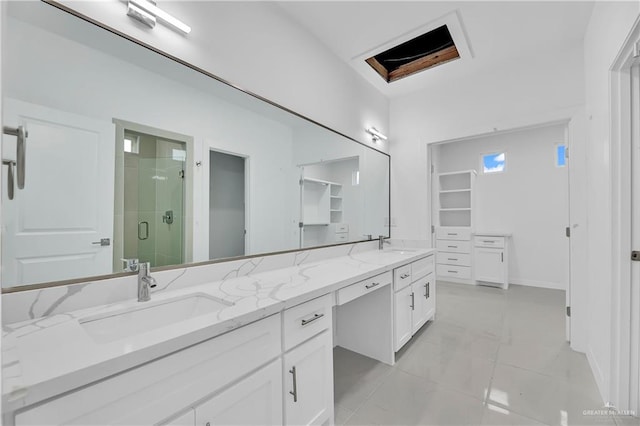 bathroom featuring tile patterned flooring, walk in shower, and vanity