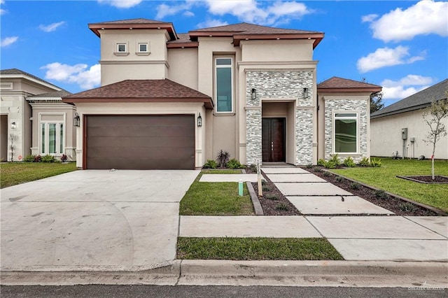 view of front of property featuring a garage and a front yard