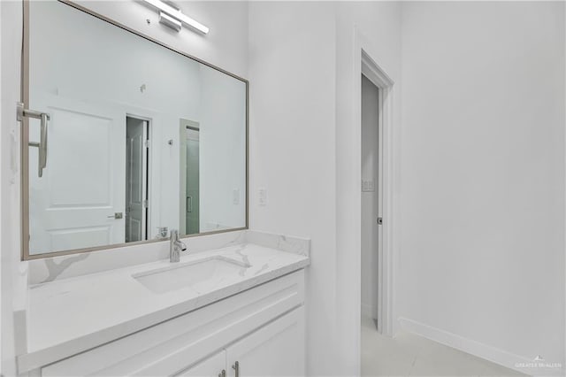 bathroom featuring tile patterned flooring and vanity