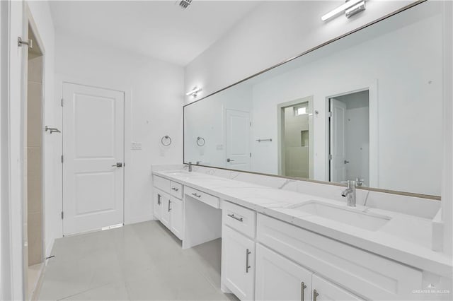 bathroom featuring tile patterned floors and vanity