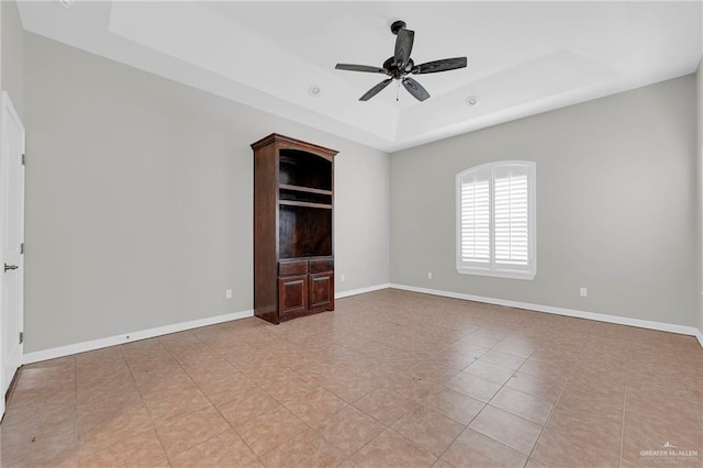 3517 N 43rd St, Mcallen, TX 78501 - unfurnished room with a tray ceiling, ceiling fan, baseboards, and light tile patterned floors