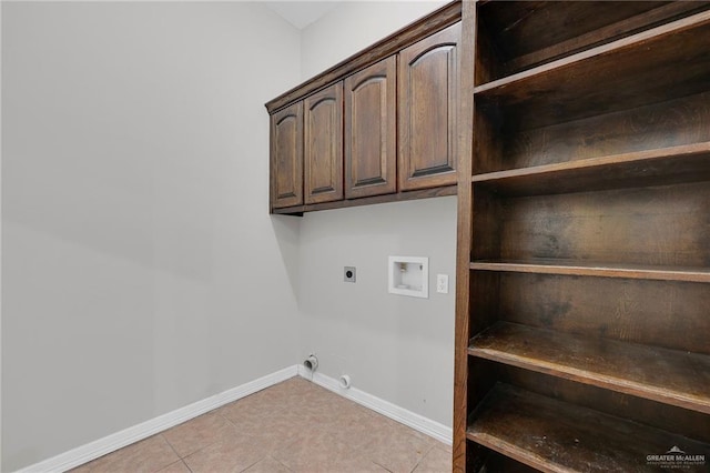 3517 N 43rd St, Mcallen, TX 78501 - laundry area with electric dryer hookup, hookup for a washing machine, cabinet space, baseboards, and light tile patterned floors
