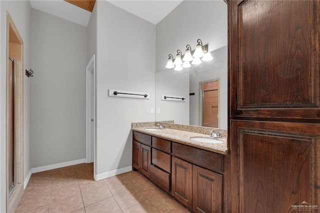 3517 N 43rd St, Mcallen, TX 78501 - full bath with double vanity, baseboards, tile patterned floors, and a shower with shower door
