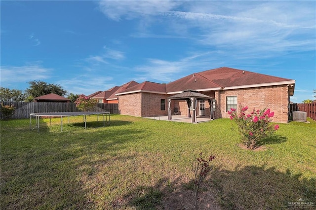 3517 N 43rd St, Mcallen, TX 78501 - rear view of property with a gazebo, a trampoline, a patio area, and brick siding