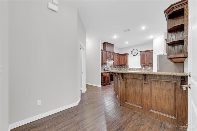 3517 N 43rd St, Mcallen, TX 78501 - kitchen featuring dark wood-style floors, open shelves, a peninsula, backsplash, and baseboards