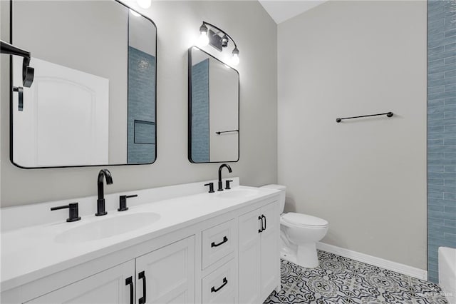 3517 N 43rd St, Mcallen, TX 78501 - bathroom with double vanity, toilet, and baseboards