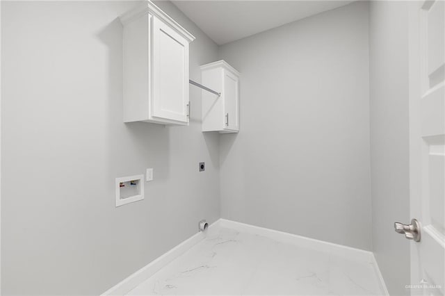 washroom with electric dryer hookup, cabinets, and washer hookup