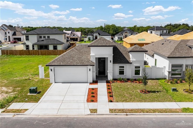 view of front facade featuring a front yard and a garage