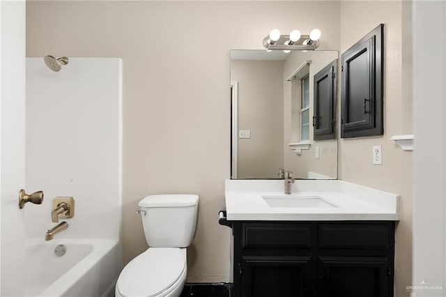 full bathroom featuring washtub / shower combination, vanity, and toilet