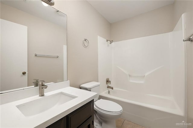 full bathroom featuring toilet, vanity, tile patterned floors, and shower / washtub combination