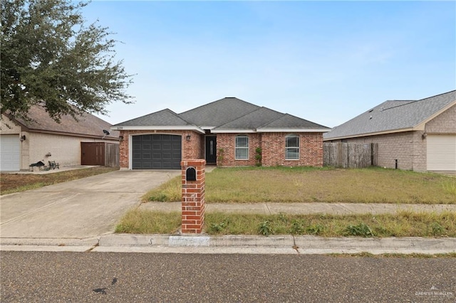 single story home with a front yard and a garage