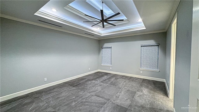 empty room featuring baseboards, a raised ceiling, a ceiling fan, ornamental molding, and recessed lighting