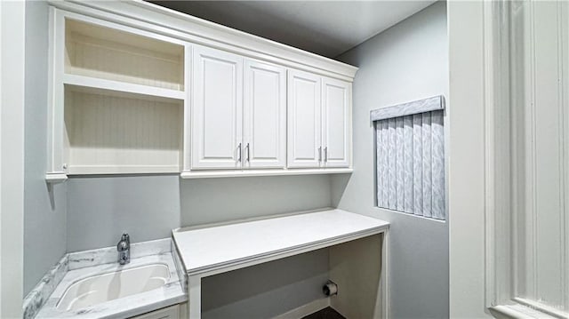 washroom with cabinet space