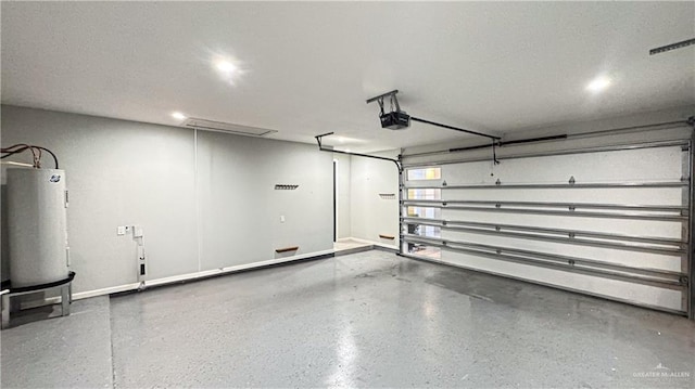 garage with baseboards, electric water heater, and a garage door opener