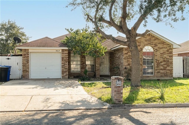 view of front of property featuring a front yard and a garage