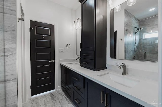 bathroom featuring vanity and a shower with shower door