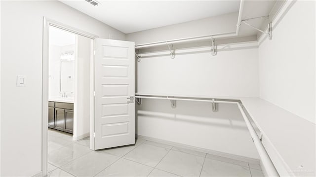 2201 Antelope Canyon St, Edinburg, TX 78541 - walk in closet featuring light marble finish flooring and a sink