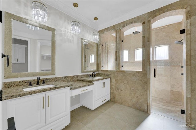 bathroom with vanity, tile patterned floors, crown molding, a notable chandelier, and an enclosed shower