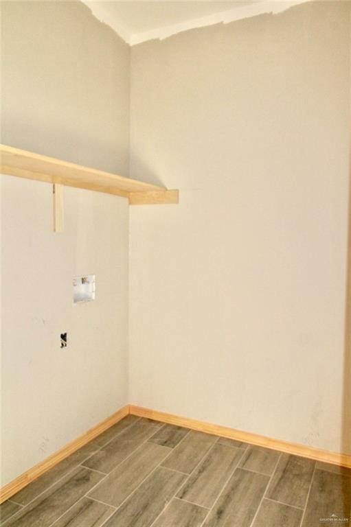 1334 S 9th St, Alamo, TX 78516 - laundry area with wood finish floors and baseboards
