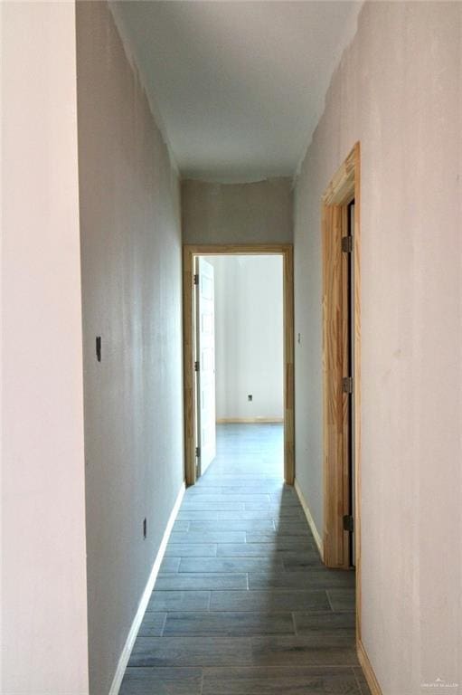 1334 S 9th St, Alamo, TX 78516 - hallway with wood finished floors and baseboards